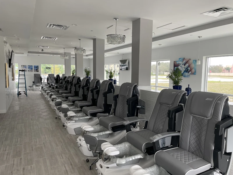 Bright salon interior with a row of pedicure chairs
